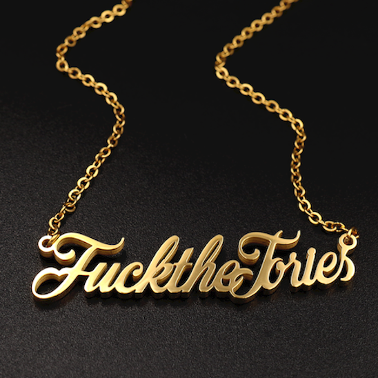 A ‘Fuck The Tories’ necklace by Topple & Burn – bold political jewellery available in rose gold, yellow gold, and silver.