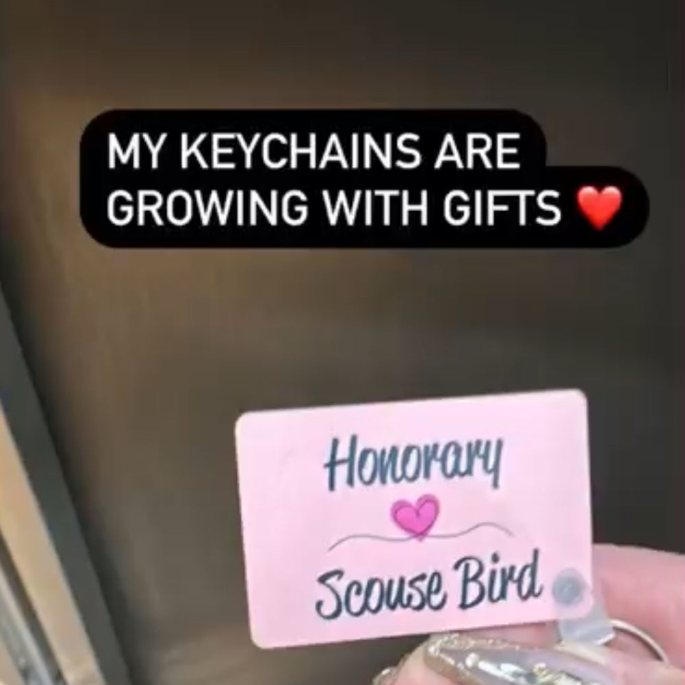 Michelle Visage of drag race holding an honorary scouse bird keyring