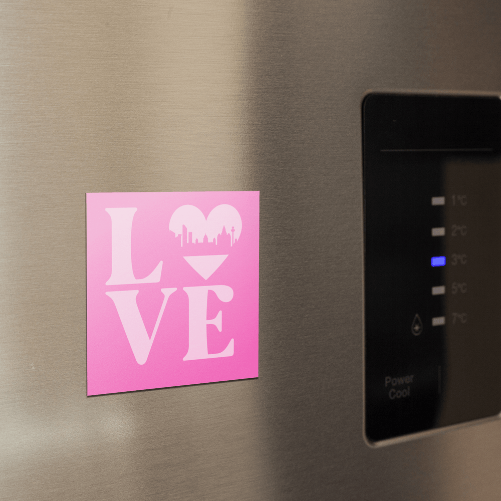 A pale pink fridge magnet featuring the word LOVE, with a heart-shaped Liverpool skyline design – the perfect Liverpool souvenir or gift.