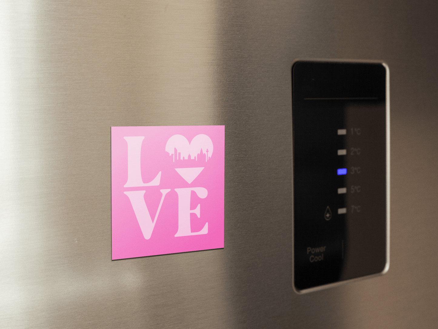 A pale pink fridge magnet featuring the word LOVE, with a heart-shaped Liverpool skyline design – the perfect Liverpool souvenir or gift.